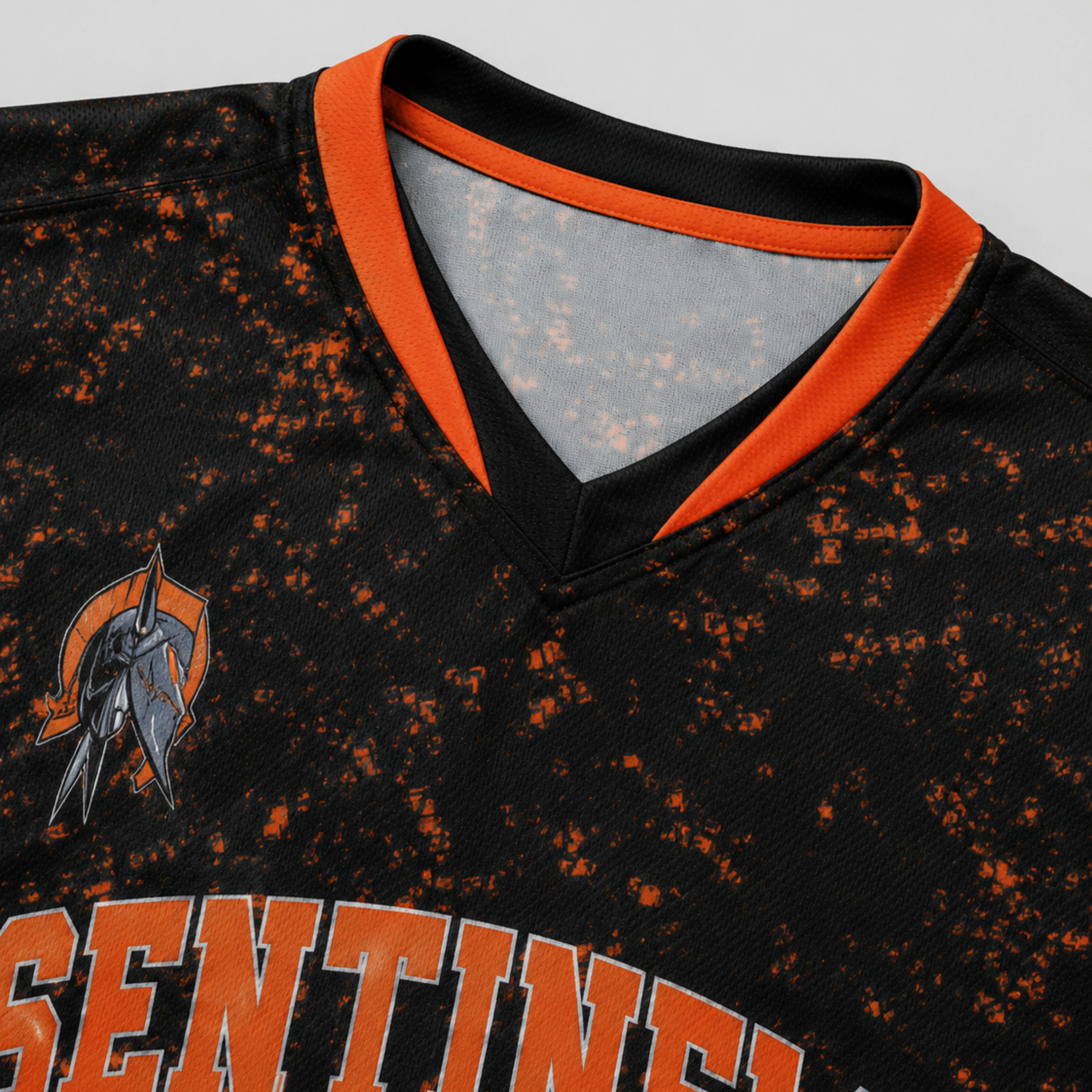 Close-up of the double-layered v-neck collar and mascot logo on a custom volleyball jersey