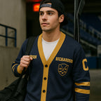 Man in varsity cardigan with hockey stick and sports duffle bag at indoor arena