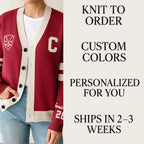 Woman wearing custom red varsity letterman cardigan with white trim and emblem, text highlights knit to order and personalization options.