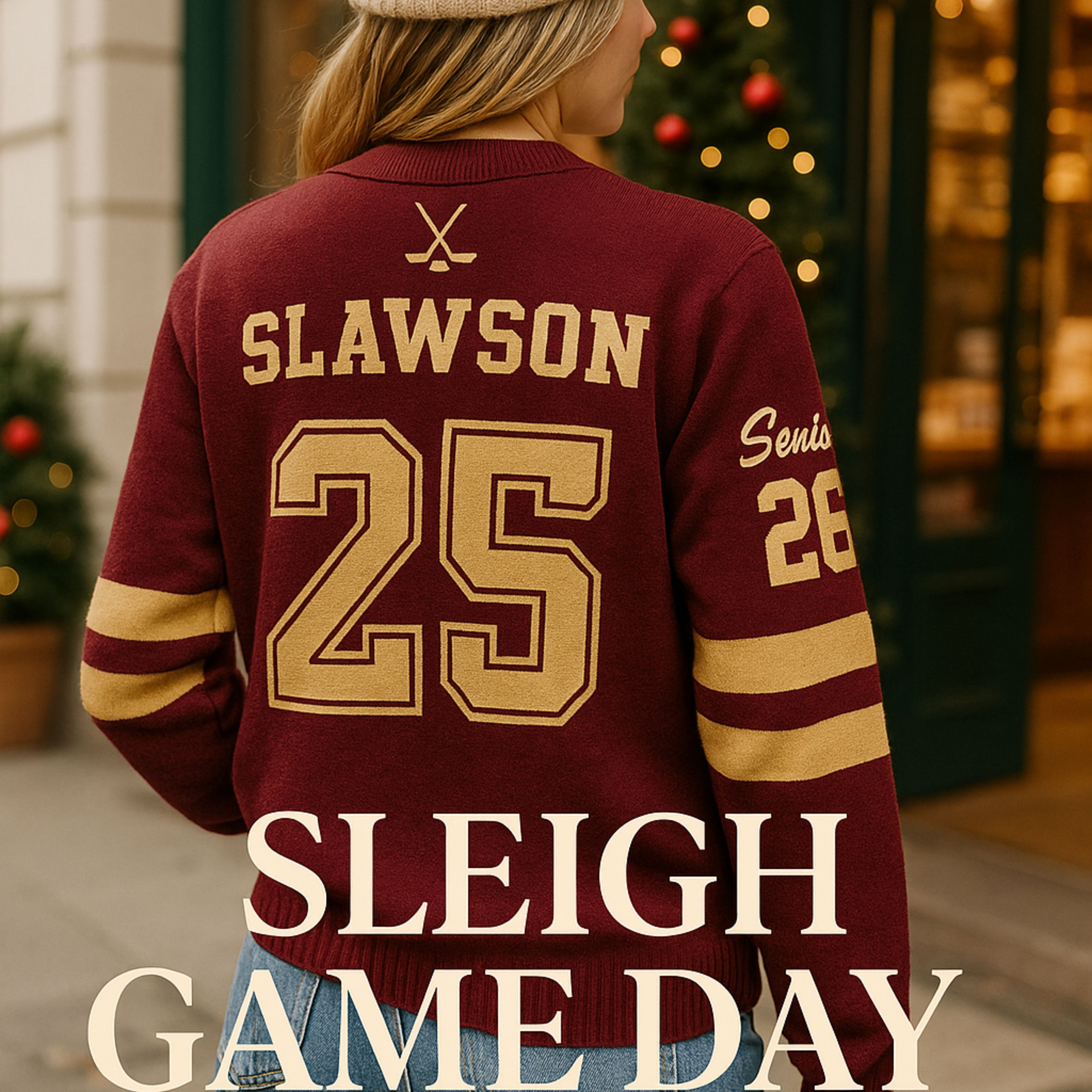Woman wearing maroon varsity sweater with gold Slawson 25, outside near Christmas decor