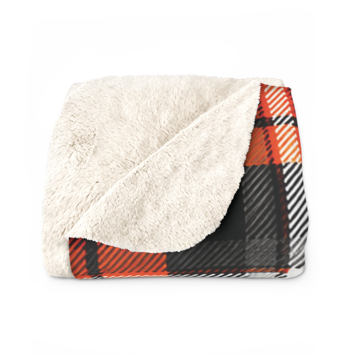 A folded plush blanket with a cream sherpa fleece side and a orange, black, and white plaid patterned side, shown on a plain white background.