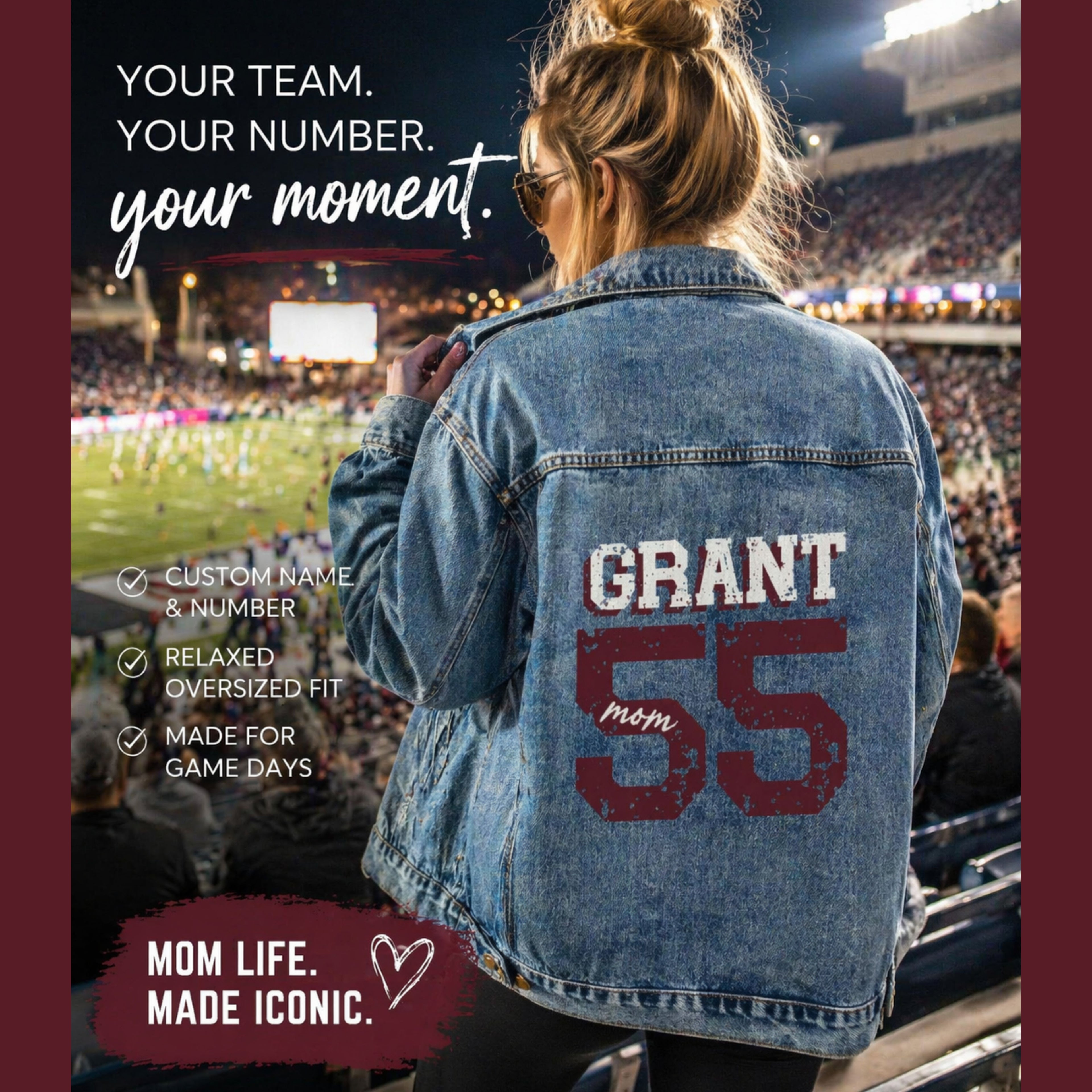 Person wearing a denim jacket with 'GRANT 55 mom' on the back at a sports event.