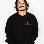 Man wearing a black sweatshirt with a white faith and swim Christian Faith based
