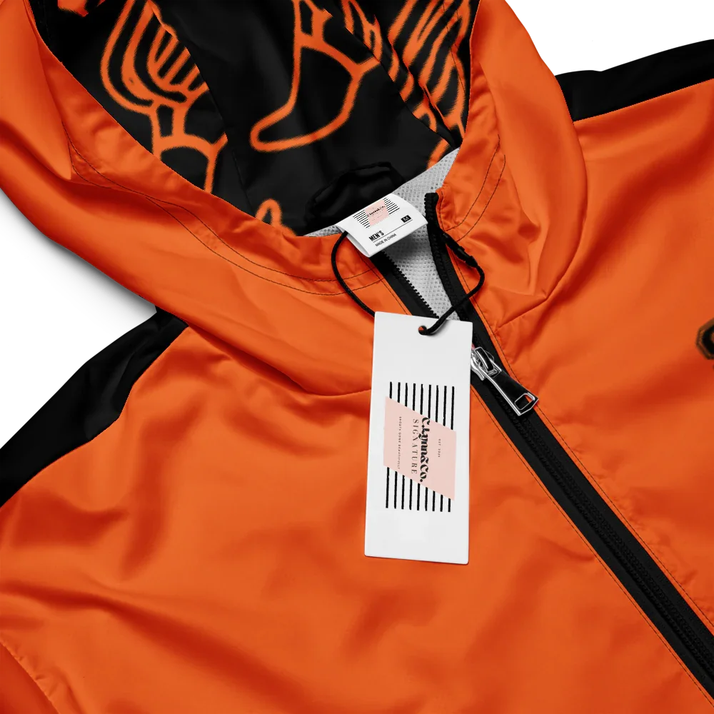 Close-up of an orange jacket with a brand tag on a white background