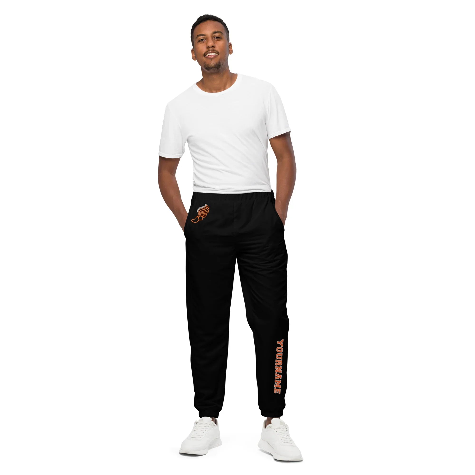Man wearing a white t-shirt and purple tracksuit pants on a white background