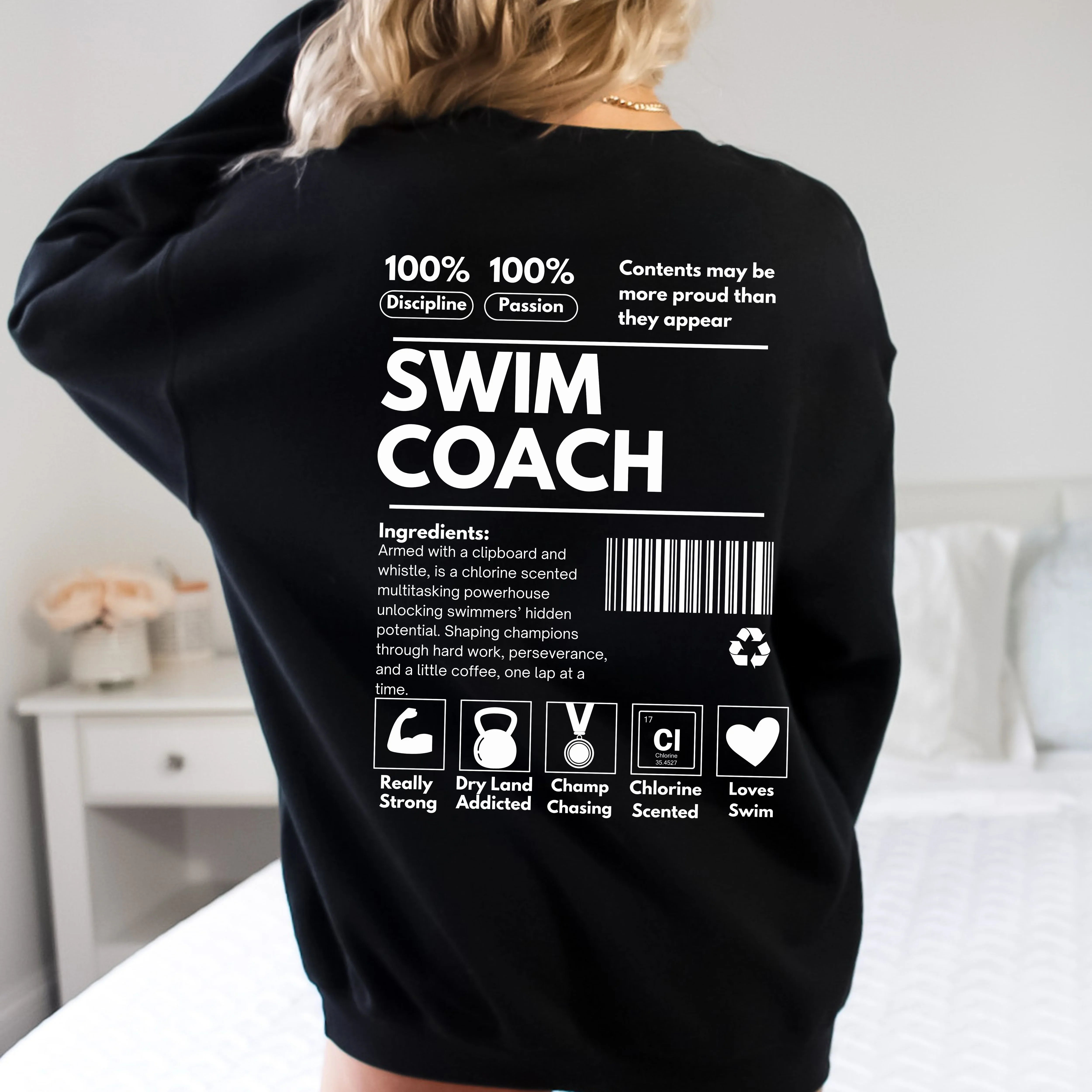 Black Swim Coach Ingredient Label Sweatshirt with white text worn by a woman