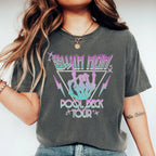Person wearing a dark gray t-shirt with colorful graphic design and text.