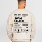 Beige sweatshirt with text on the back, worn by a person, on a light gray background
